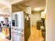 Modern stainless steel refrigerator and laundry area with new washer and dryer at 12930 River Grove Dr, Columbus, IN 47203