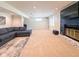 Spacious living room with a fireplace, modern television, and a comfortable sectional sofa at 12930 River Grove Dr, Columbus, IN 47203