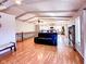 A spacious living room with hardwood floors, a stone fireplace, and vaulted ceilings at 12930 River Grove Dr, Columbus, IN 47203