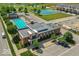 Beautiful aerial view of community pool, tennis courts, and new home construction in a serene setting at 12974 Pettigru Dr, Carmel, IN 46032