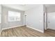 Neutral bedroom with wood-look floors, ample natural light, and a closet at 12974 Pettigru Dr, Carmel, IN 46032
