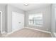 Relaxing bedroom showcases closet, a bright window, and neutral finishes creating a cozy space at 12974 Pettigru Dr, Carmel, IN 46032