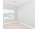 Simple bedroom design has big window for plenty of light, with carpeted floor and light walls at 12974 Pettigru Dr, Carmel, IN 46032