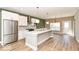 Spacious kitchen featuring stainless steel appliances and a large center island at 12974 Pettigru Dr, Carmel, IN 46032