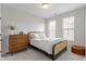 Bedroom features natural light, a statement bed frame, and neutral decor at 13071 Pennington Rd, Fishers, IN 46037