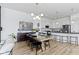 Open-concept dining area leading to a modern kitchen, perfect for entertaining and Gathering gatherings at 13071 Pennington Rd, Fishers, IN 46037