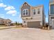 Attractive two-story townhome with a two-car garage, neutral paint, and easy access to green spaces at 13071 Pennington Rd, Fishers, IN 46037