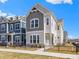 Charming two-story home boasts a well-manicured lawn and attractive architectural details at 13071 Pennington Rd, Fishers, IN 46037