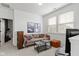 Cozy living room with comfortable seating, neutral decor, and natural light from the windows at 13071 Pennington Rd, Fishers, IN 46037
