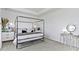 Spacious main bedroom featuring a canopy bed, light gray walls, and carpeted floors at 13071 Pennington Rd, Fishers, IN 46037