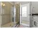 Stylish shower with glass door, tiled walls, and a view into another room at 13071 Pennington Rd, Fishers, IN 46037