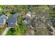 An aerial view of a home with lush greenery, landscaping, and surrounding neighborhood at 140 E 44Th St, Indianapolis, IN 46205