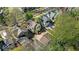 Aerial view highlights the home's architectural style, mature trees, surrounding neighborhood, and private backyard at 140 E 44Th St, Indianapolis, IN 46205