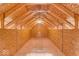 Unfinished attic with exposed wooden beams and plywood flooring at 140 E 44Th St, Indianapolis, IN 46205