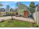 Charming home featuring a backyard with a hot tub and wood accents at 140 E 44Th St, Indianapolis, IN 46205