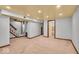 Finished basement with carpet flooring, recessed lighting, and access to the stairs at 140 E 44Th St, Indianapolis, IN 46205