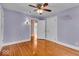 Bedroom with wood floors, a ceiling fan, and an ensuite bathroom at 140 E 44Th St, Indianapolis, IN 46205