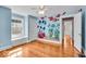 Whimsical bedroom with hardwood floors, window seat, and colorful fish mural at 140 E 44Th St, Indianapolis, IN 46205
