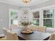 Bright dining room with large windows, built-in shelving, and hardwood floors at 140 E 44Th St, Indianapolis, IN 46205