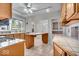 Kitchen featuring tile floors, wood cabinets, and a breakfast nook at 140 E 44Th St, Indianapolis, IN 46205