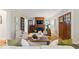 Cozy living room with a fireplace, wooden mantel, and hardwood floors at 140 E 44Th St, Indianapolis, IN 46205
