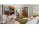 Cozy living room with a fireplace, wooden mantel, and hardwood floors at 140 E 44Th St, Indianapolis, IN 46205