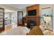 Living room boasts a fireplace, built-ins, and hardwood floors leading to the dining area at 140 E 44Th St, Indianapolis, IN 46205