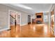Bright living room boasts gleaming hardwood floors, fireplace, and elegant french doors to other rooms at 140 E 44Th St, Indianapolis, IN 46205