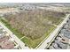 Aerial view shows the large wooded area within the neighborhood and the neatly laid out streets and homes at 14234 Community Dr, Carmel, IN 46033