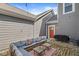 Outdoor patio with seating, grill, and well-maintained gray siding at 14234 Community Dr, Carmel, IN 46033