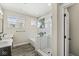 Bright bathroom with a glass-enclosed shower, subway tile, and a double vanity at 14234 Community Dr, Carmel, IN 46033