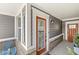 Charming front entrance with a decorative door and sidelights, adding curb appeal to the home at 14234 Community Dr, Carmel, IN 46033