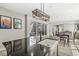 Kitchen island with seating and sink, with a view of the outdoor patio at 14234 Community Dr, Carmel, IN 46033