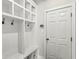 Mudroom with built-in cubbies, coat hooks, and ample storage space for organization at 14234 Community Dr, Carmel, IN 46033