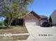 Beautiful brick home with a spacious driveway and a well-manicured front lawn at , Greenwood, IN 46143