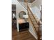Elegant staircase with wood railings, neutral carpet, and stylish accent pieces at , Greenwood, IN 46143