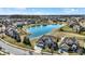 Aerial view of a beautiful home with a large pond, surrounded by a peaceful neighborhood at 14347 Camelot House Way, Fishers, IN 46037