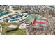 Aerial view of community amenities including swimming pools, tennis and basketball courts, a playground and a clubhouse at 14347 Camelot House Way, Fishers, IN 46037