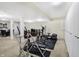 Basement area equipped with workout equipment and a storage wall at 14347 Camelot House Way, Fishers, IN 46037