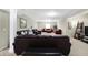 Finished basement with theater seating and a variety of leather couches at 14347 Camelot House Way, Fishers, IN 46037