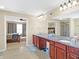 Large bathroom with double vanity, granite countertop, and tiled floor at 14347 Camelot House Way, Fishers, IN 46037