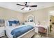 Cozy bedroom featuring a white bed frame, blue accents, and a matching vanity area at 14347 Camelot House Way, Fishers, IN 46037