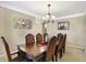 Stylish dining room featuring a modern mirror wall and chandelier over a large table at 14347 Camelot House Way, Fishers, IN 46037