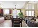 Inviting dining area with a long wooden table and ample seating, open to the living space at 14347 Camelot House Way, Fishers, IN 46037