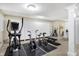 Basement gym with exercise equipment, white storage cabinets, and ample lighting at 14347 Camelot House Way, Fishers, IN 46037