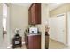 Hallway nook with granite countertop, custom cabinet and decorative vase at 14347 Camelot House Way, Fishers, IN 46037