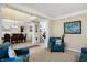 Open-concept living room flows into the dining area, creating an ideal entertaining space at 14347 Camelot House Way, Fishers, IN 46037