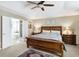 A comfortable main bedroom with neutral paint, carpet, and large bed at 14347 Camelot House Way, Fishers, IN 46037