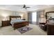 Comfortable main bedroom with a large bed, ceiling fan, and carpet at 14347 Camelot House Way, Fishers, IN 46037