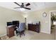 Office space featuring a dark wood desk, ceiling fan, accent lighting and hardwood floors at 14347 Camelot House Way, Fishers, IN 46037